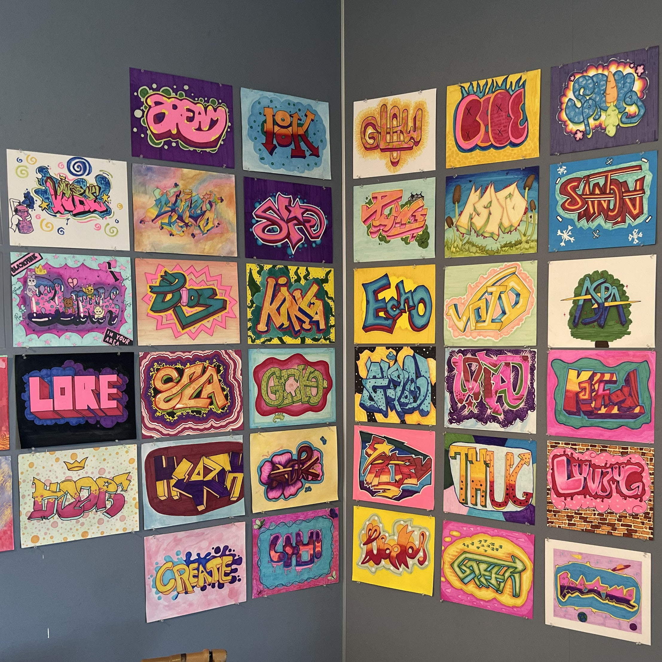 Wall of numerous graffiti style artwork pieces
