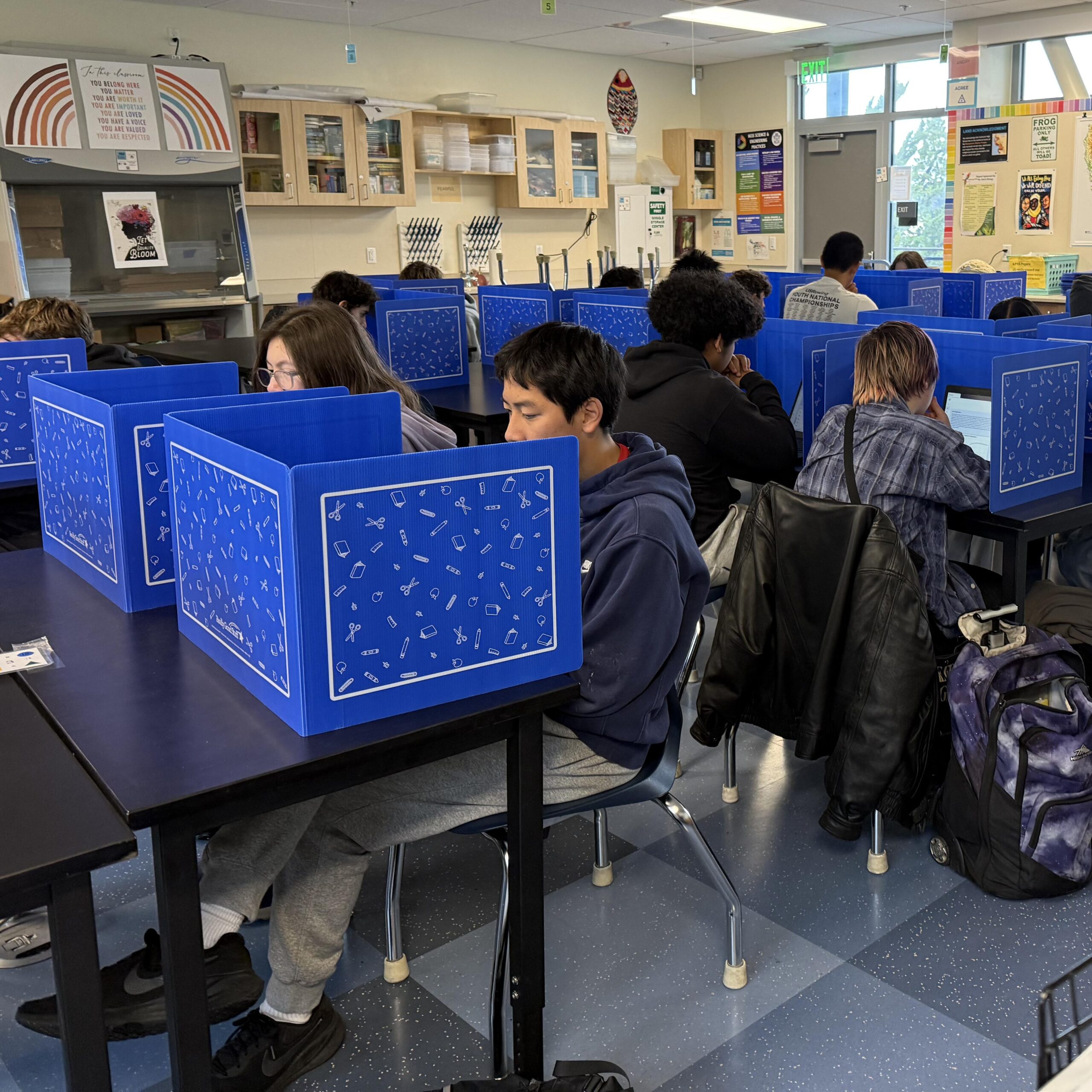 Biology students using privacy shields in class