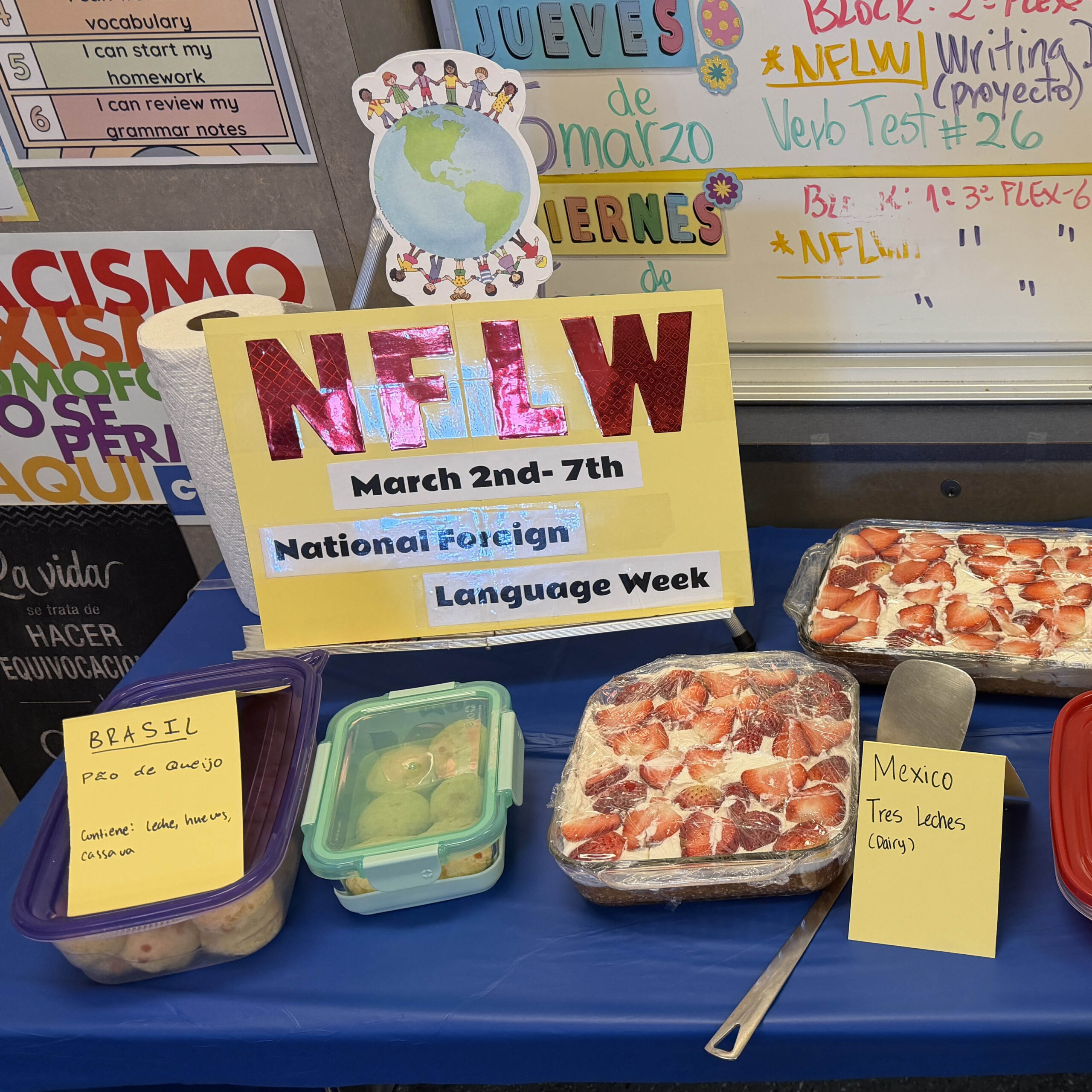 Spanish national foreign language week sign and table with regional food